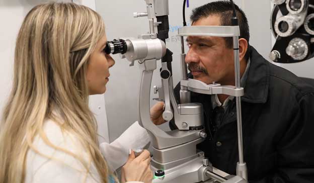 Eye doctor completing an exam on a patient